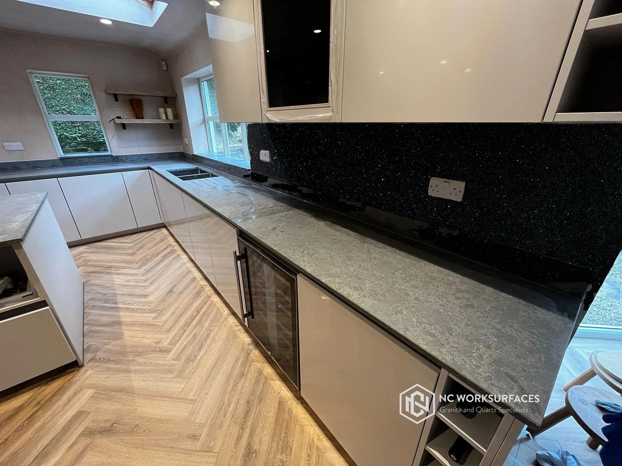 L-shaped run, dark worktop — visualised with Absolute Black granite
