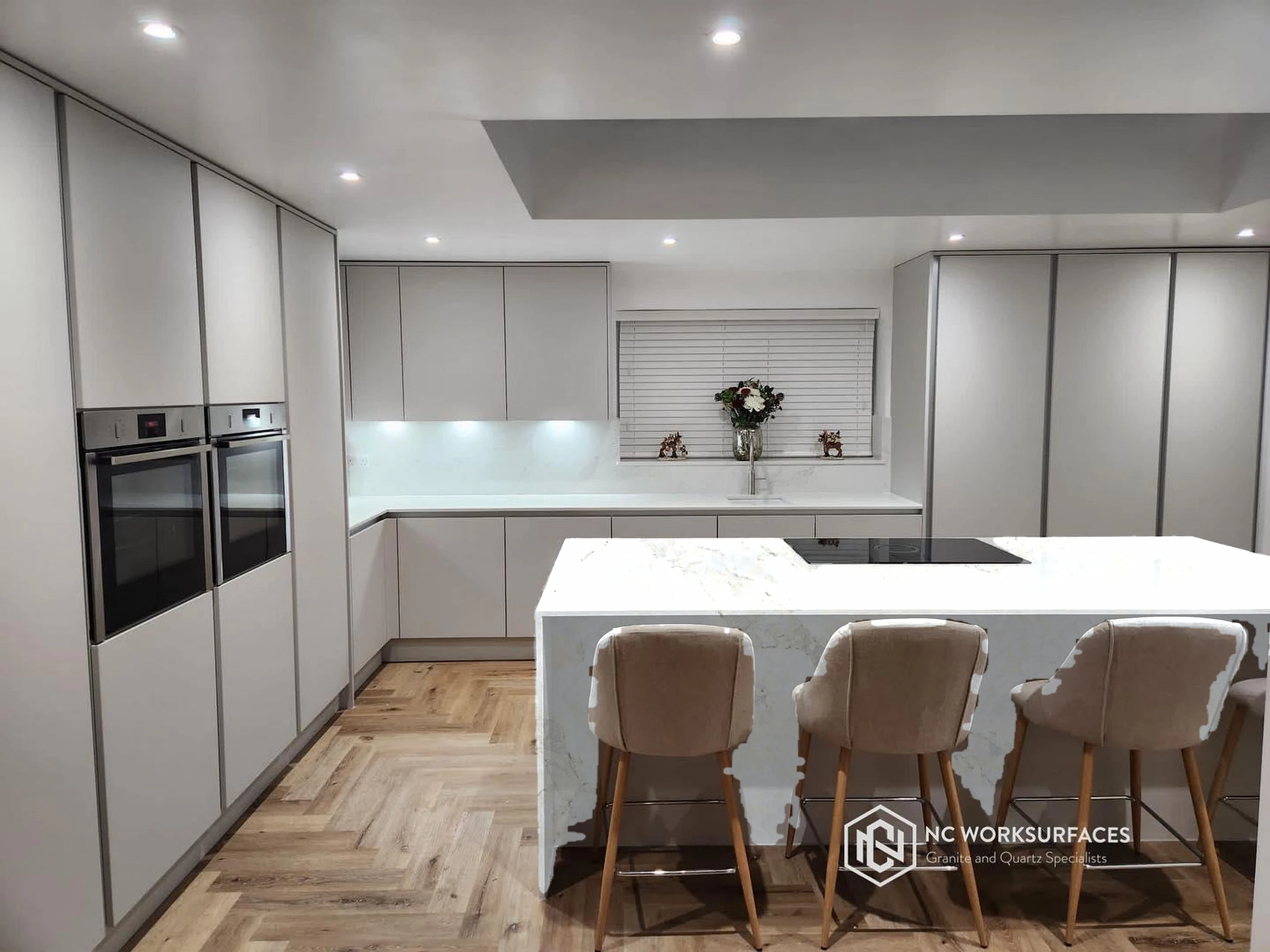 White island with L-run — visualised with Calacatta Nuvo quartz
