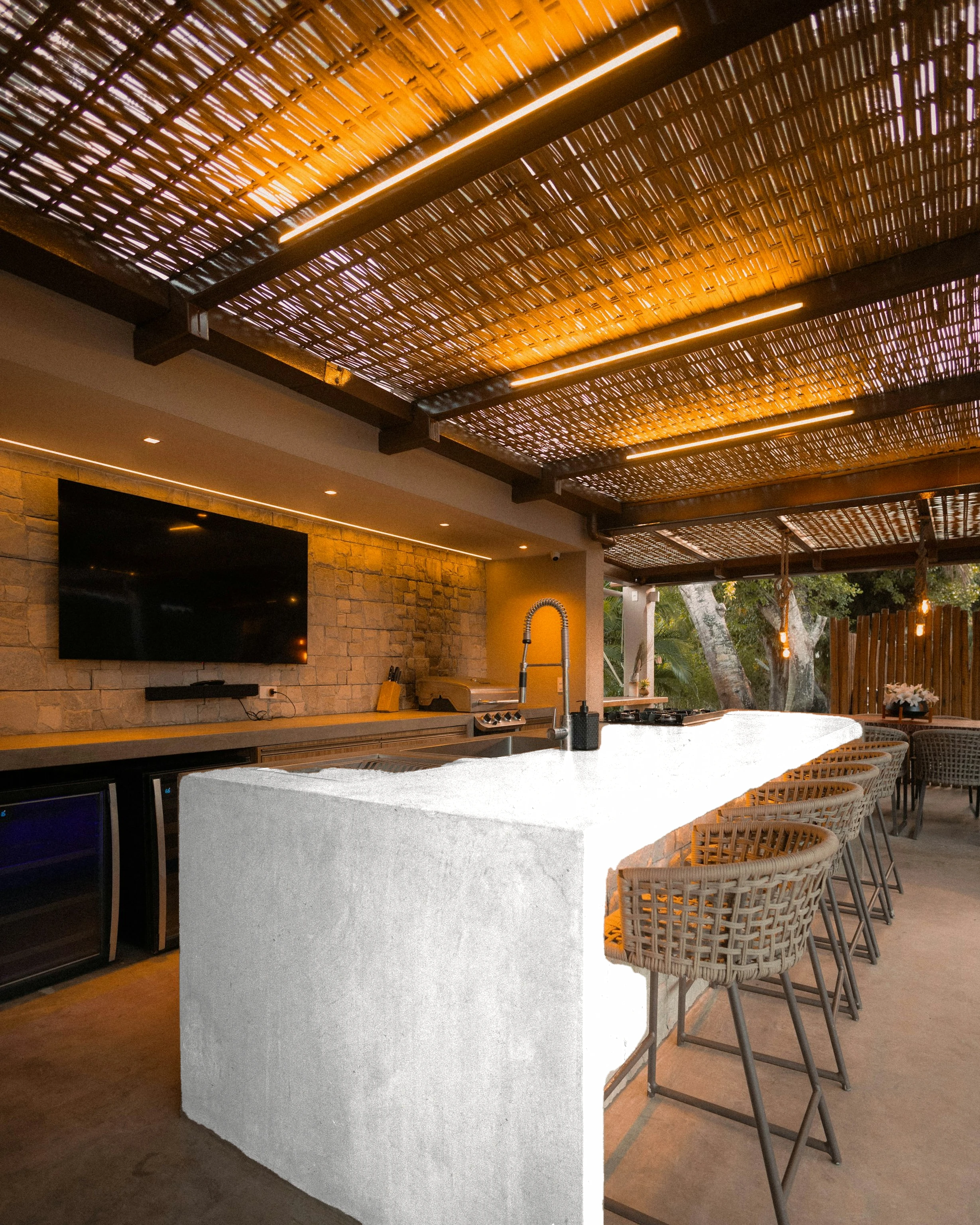Polished-concrete bar island — visualised with London Grey quartz